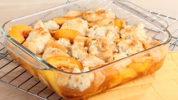 Double The Fun Of Peach Cobbler By Adding Cinnamon Rolls