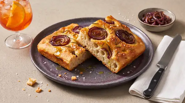 Bake Italian focaccia with caramelized onions and rosemary
