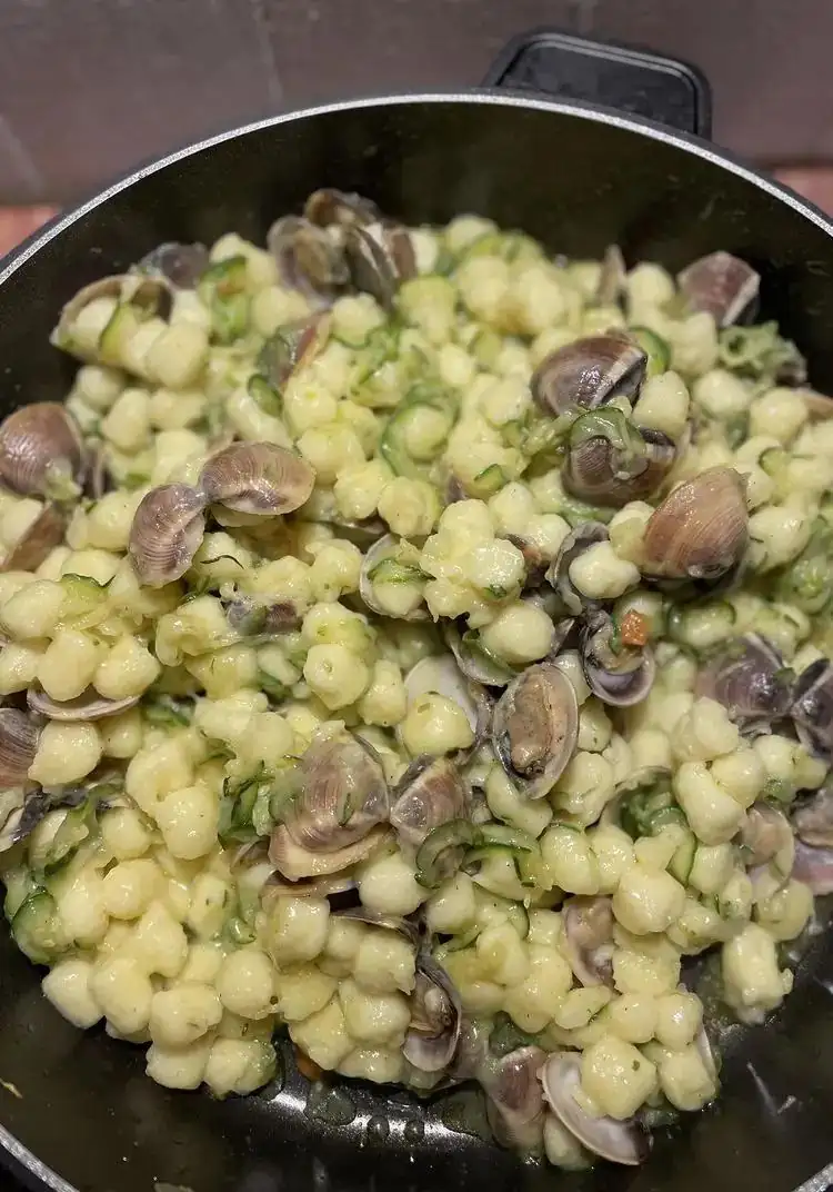 Potato gnocchi with clams, courgettes and stracciatella