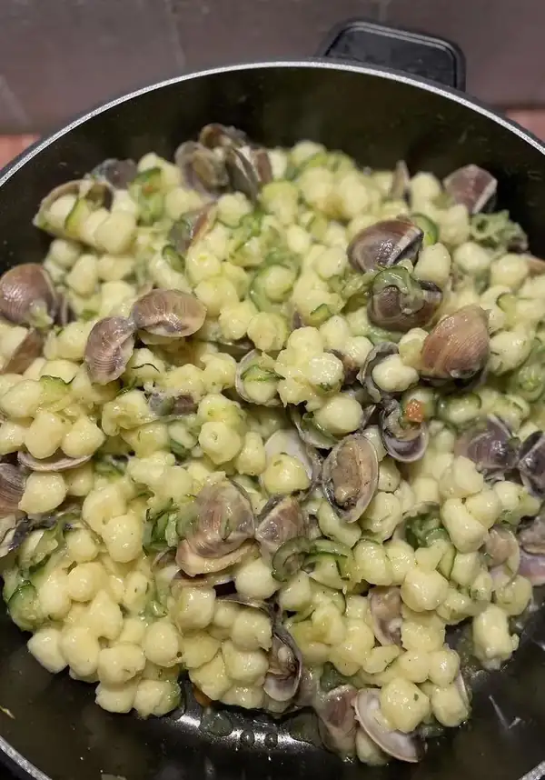Potato gnocchi with clams, courgettes and stracciatella