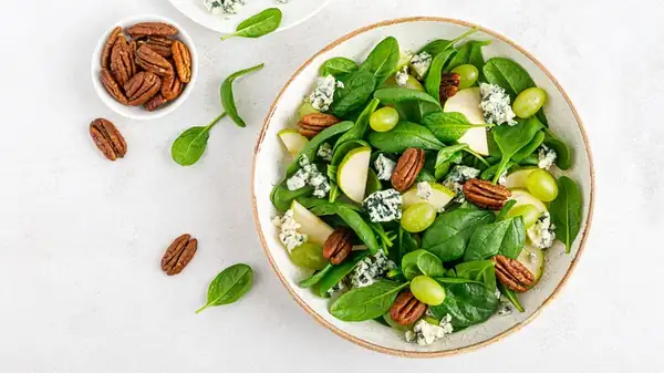 The Clever Way To Add Nuts To Your Salads