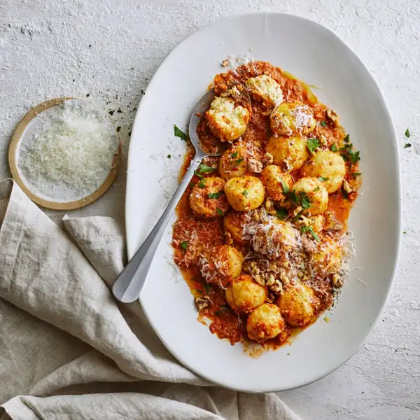 Ricotta gnudi with romesco sauce
