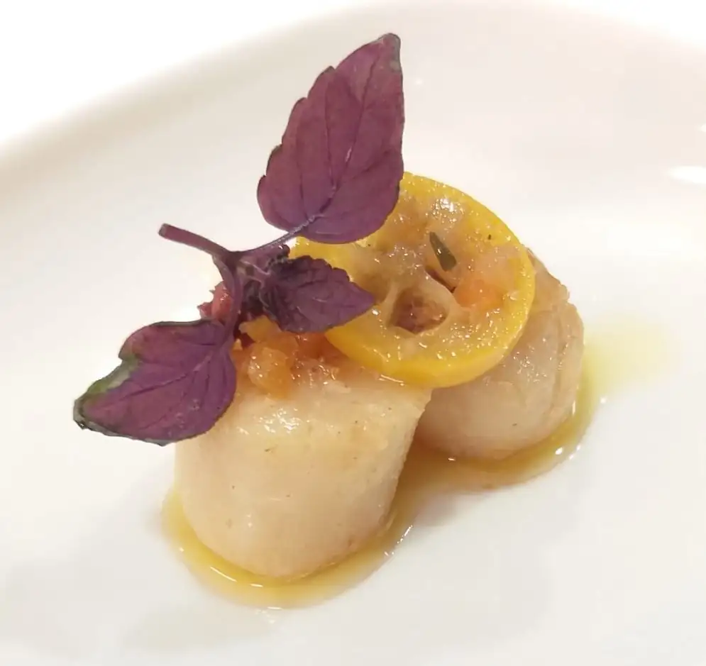 Confit scallop with Kalamata and kumquat escabeche