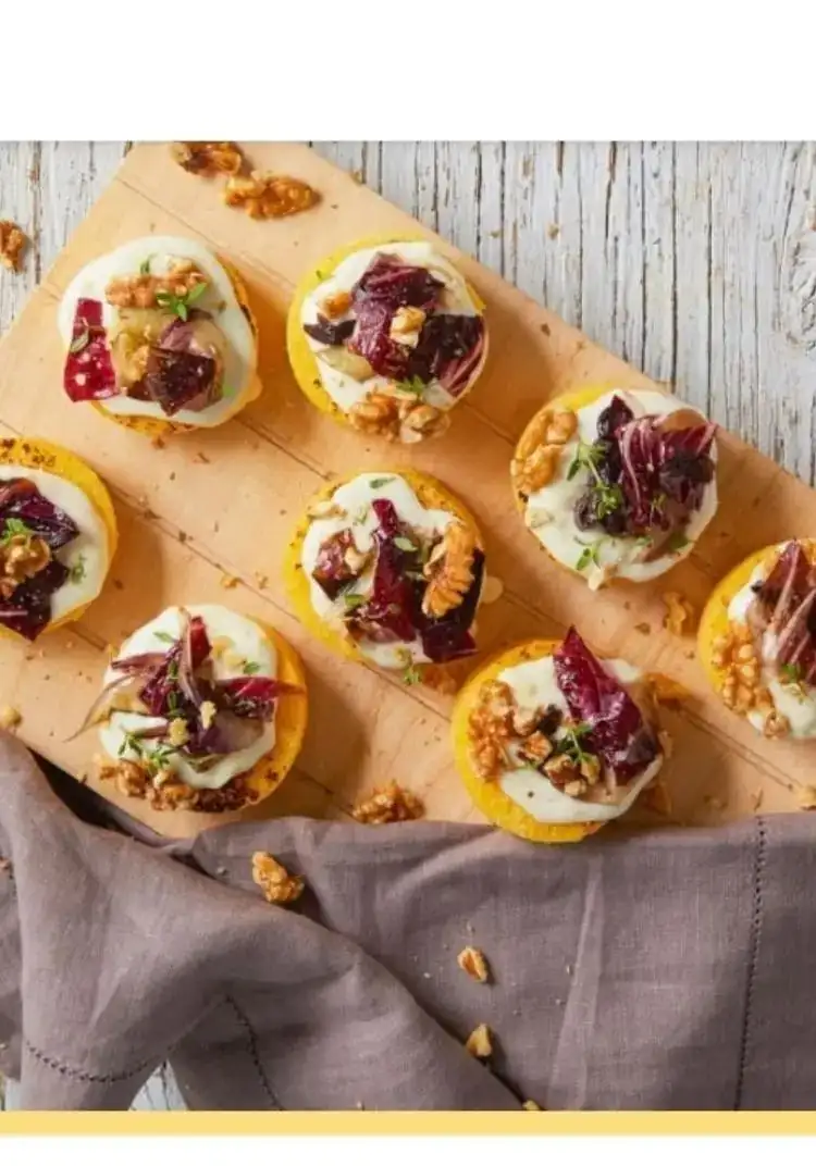 Polenta crostini with spreadable cheese, radicchio, and walnuts