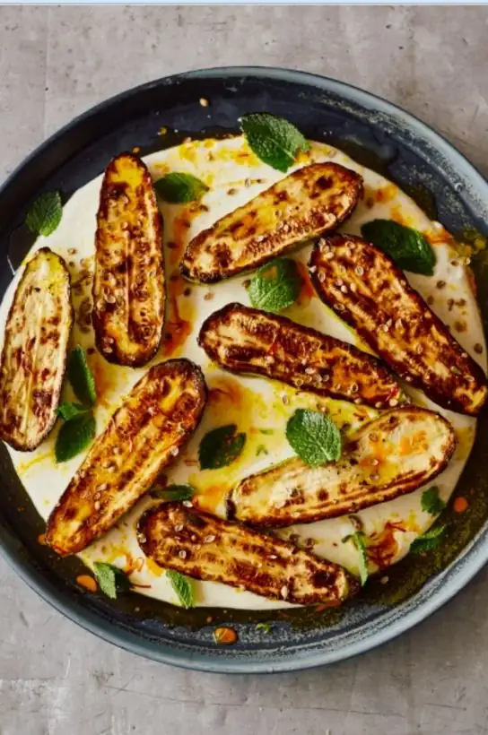 Grilled courgettes with warm yoghurt and saffron butter