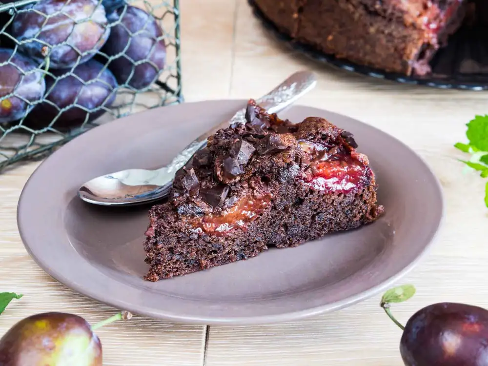 Intensely chocolatey cake with plums