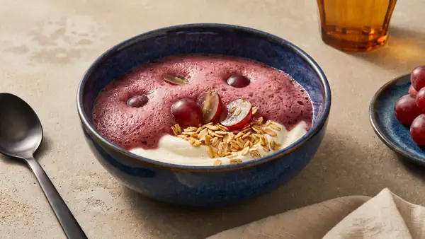 Grape foam bowl with creamy skyr and toasted oat flakes