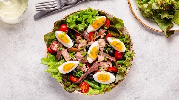 The Contentious Origins Of The Niçoise Salad