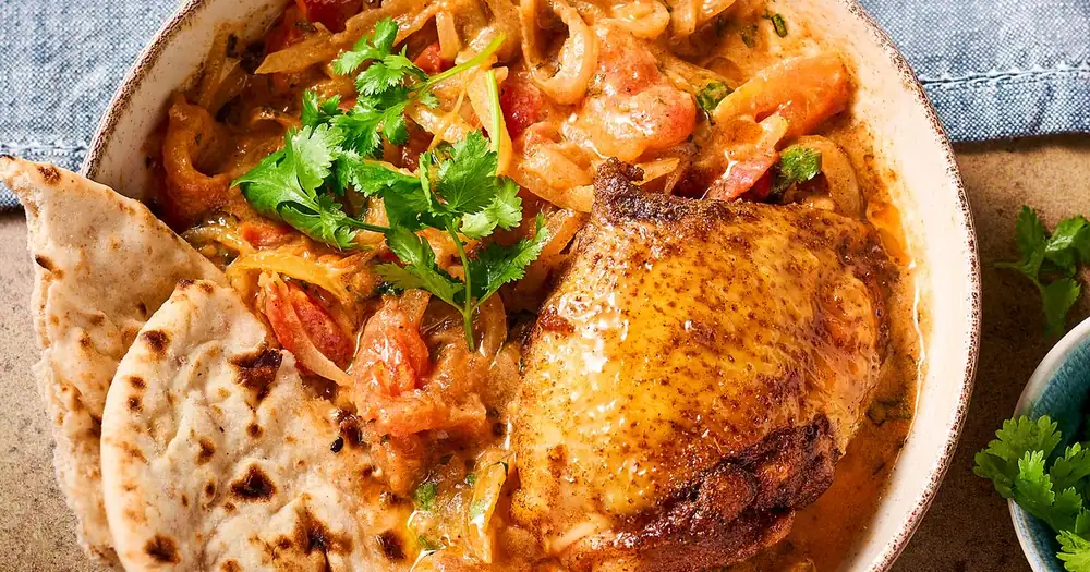 Pollo estofado con garam masala y tomates