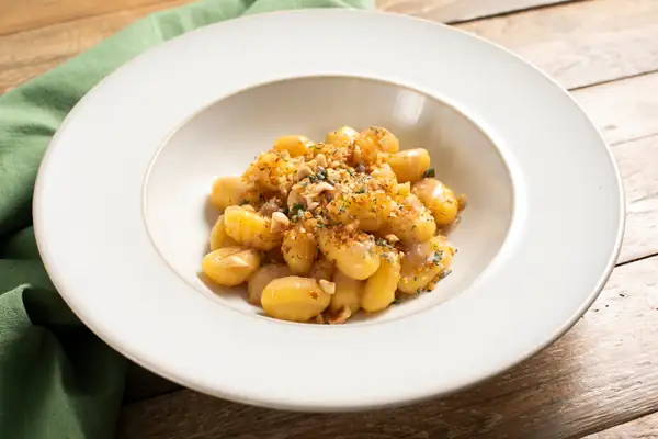 Gluten-free gnocchi with butter, anchovies and herbs